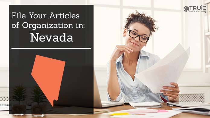 Woman smiling while looking at her articles of organization for Nevada.