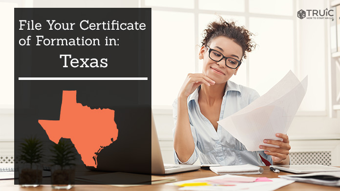 Woman smiling while looking at her certificate of formation for Texas.