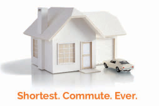 White model house with white toy car parked in driveway