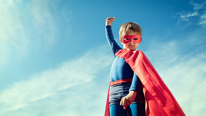 a boy wearing a super hero costume