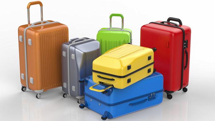 a variety of different colors and sizes of luggage