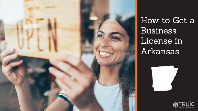 Woman holding open sign after getting her business license