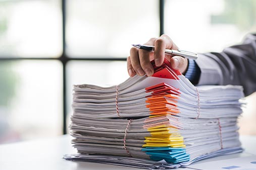 Man jumping with paperwork. To the right it reads, "We make paperwork fun. (Ok we don't but we do make it free.)"