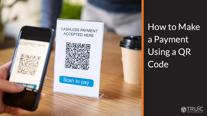 Person making a payment using a QR Code.