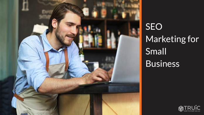 Small business owner working on SEO marketing on a laptop.