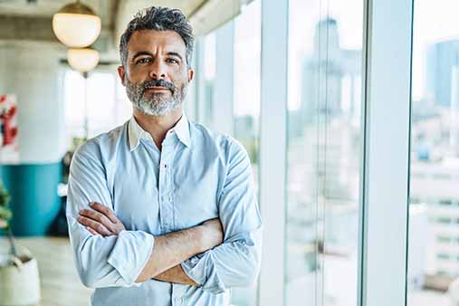 Businessman standing with crossed arms