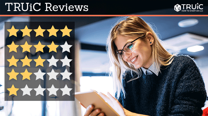 Truic reviews image. Woman smiling while looking at star ratings.