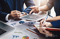 Business People collaborating at a table using a tablet